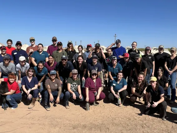 The Food Animal Club poses in a large outdoor group shot.