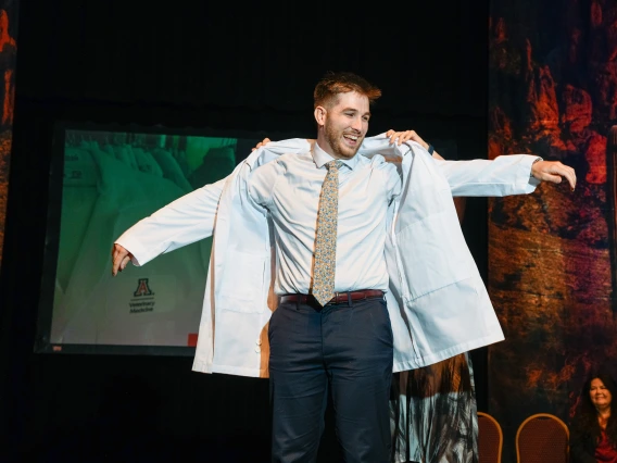 Student getting their white coat