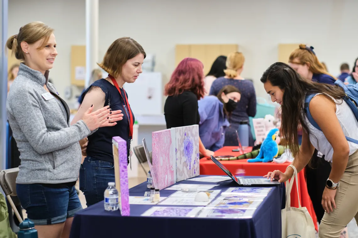 students talking to pathology club