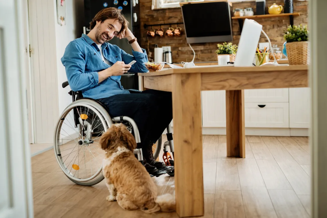 man in wheelchair with dog