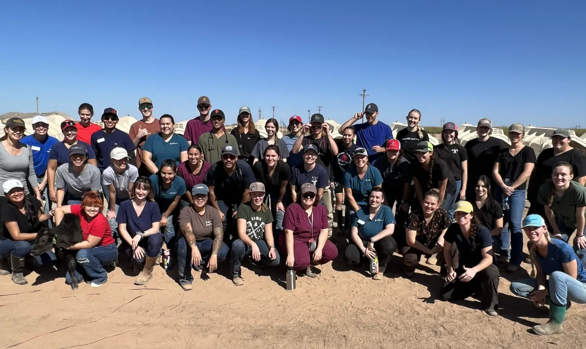 The Food Animal Club poses in a large outdoor group shot.