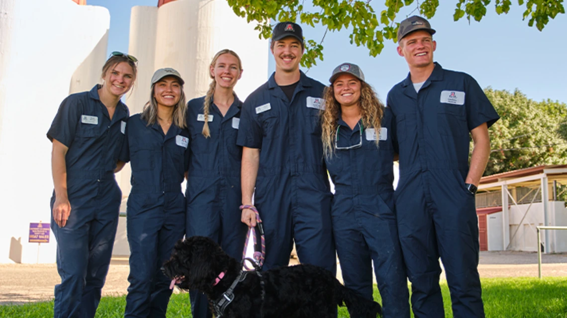 Group of students posing for photo at farm