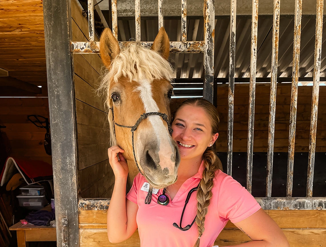 Student with horse while on rotations