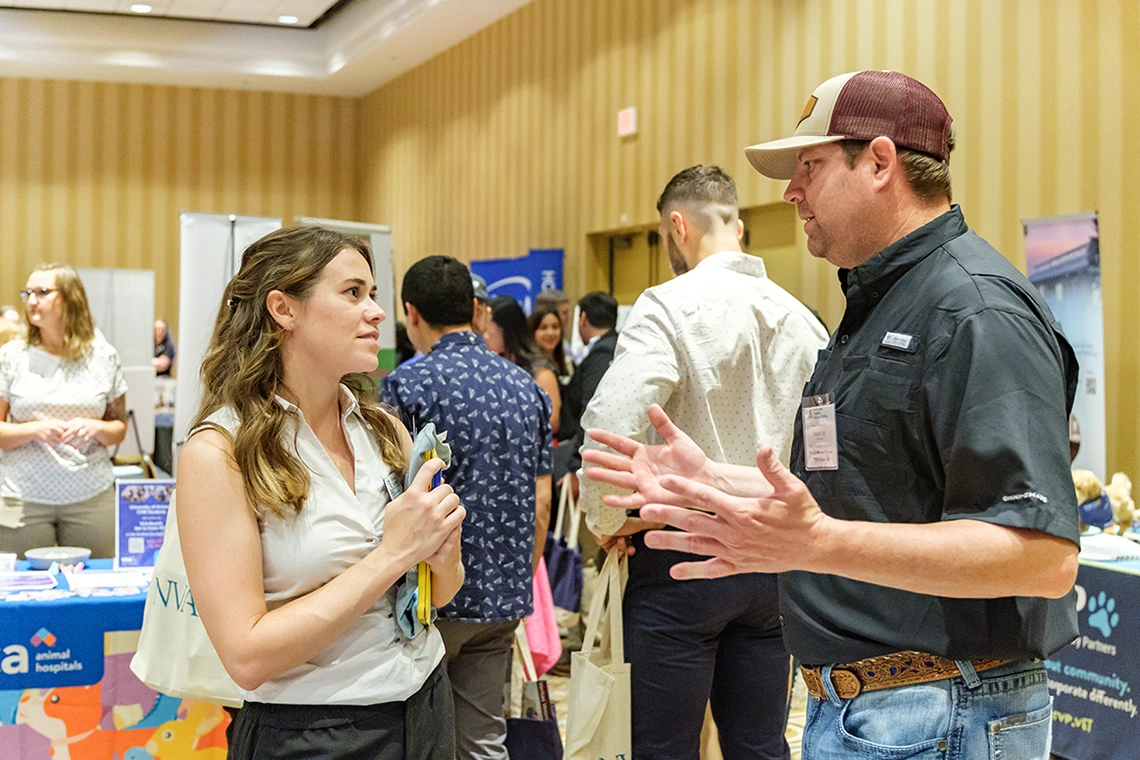 student interacting with clinic owner