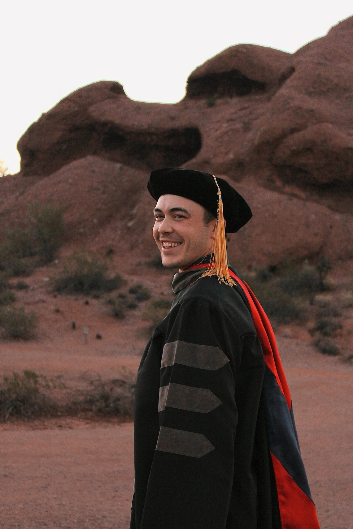Kyle in his graduation regalia