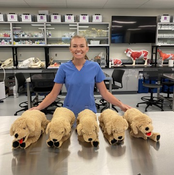 Veterinary tecnician Abbi Matzdorff displays the canine Body Condition Score models she created.
