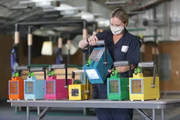 Animal care manager Lisa Hallam holds a model radiology box.