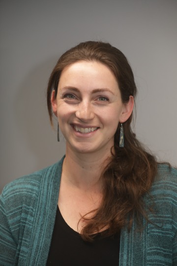 Professional headshot of Sarah Leighton, a brunette woman wearing a ponytail.