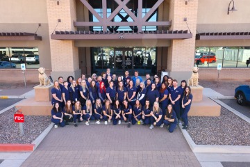 Group shot of veterinary hospital exterior with all staff.