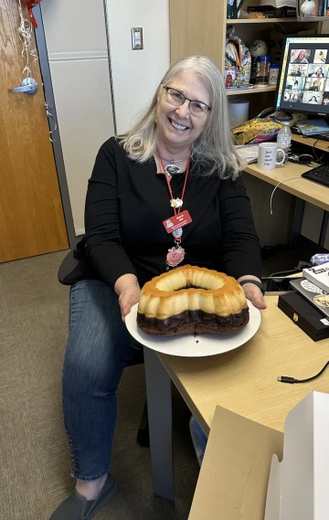 sharon smiling with a cake