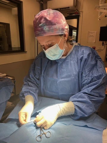 Ashton performing surgery