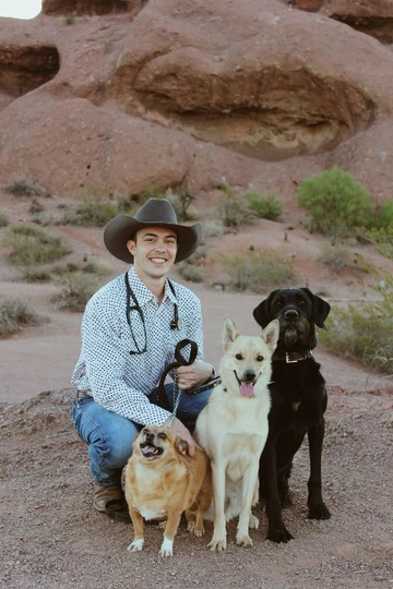 Kyle with his dogs