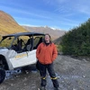 Riley posing with a off-road vehicle