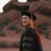 Kyle in his graduation regalia