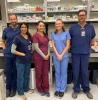 Group shot of five CVM Veterinary Technicians in a classroom.